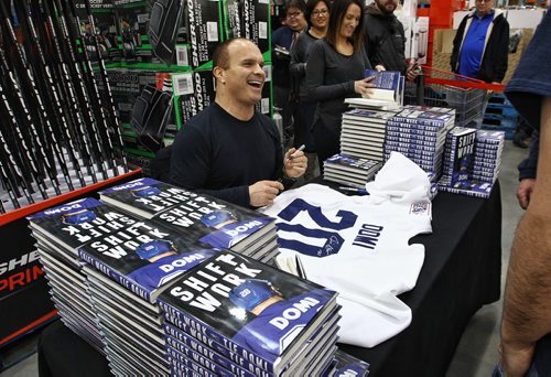Hockey legend Tie Domi at the Costco on McGillivray Boulevard Sunday afternoon joking with fans while signing copies of his memoirs Shiftwork. 151206 December 06, 2015 Mike Deal / Winnipeg Free Press