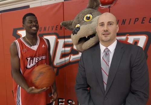 Winnipeg Wesmen star guard Denzel Lynch-Blair, left, with head coach Mike Raimbault and Wesmen Mascot Wes-Lee Coyote to promote upcoming  49th annual Wesmen Classic Basketball tournament- See Melissa Martin StoryDec 07, 2015   (JOE BRYKSA / WINNIPEG FREE PRESS)