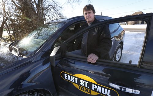 Lockport/East St. Paul  Taxi owner Glen Phillips with one of his cars. He says Unicity and Duffys are encroaching illegally on his territory and driving him out of business.  Wayne Glowacki / Winnipeg Free Press Dec. 7  2015