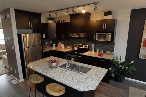 WINNIPEG, MB - NEW HOMES - 84 Danakas Drive  The Atwood Lane Condominiums. Kitchen has an island. BORIS MINKEVICH / WINNIPEG FREE PRESS DEC 7, 2015