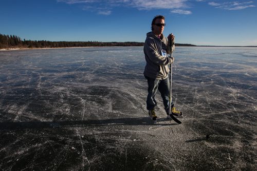 The whole of Clear Lake has frozen flat and almost perfectly clear which many are saying is a very rare event. Reporter Geoff Kirbyson skates on the clear ice of Clear Lake Monday afternoon. 151207 - Monday, December 7, 2015 -  MIKE DEAL / WINNIPEG FREE PRESS