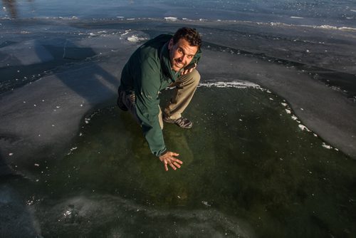 The whole of Clear Lake has frozen flat and almost perfectly clear which many are saying is a very rare event. Richard Dupuis the Riding Mountain National Park Visitor Experience Manager on the clear ice of Clear Lake Monday afternoon. 151207 - Monday, December 7, 2015 -  MIKE DEAL / WINNIPEG FREE PRESS