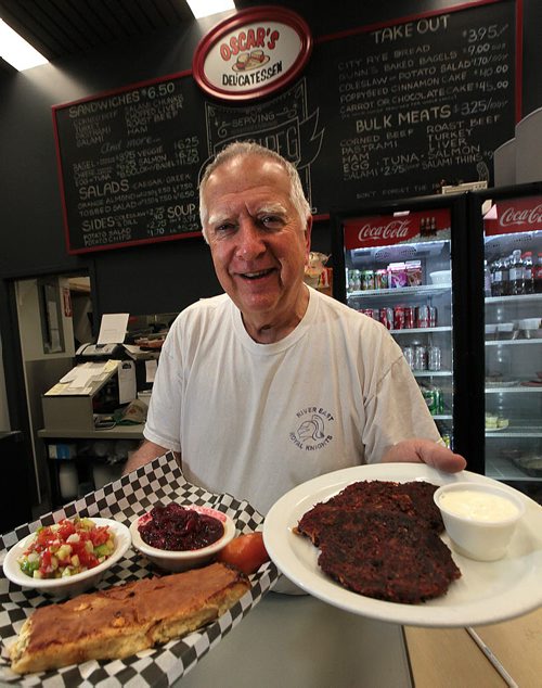 Larry Brown at Oscar's Deli show's off the Cheese Pie (left) and Potatoe/Beet Latke. See Marion's review. December 7, 2015 - (Phil Hossack / Winnipeg Free Press)