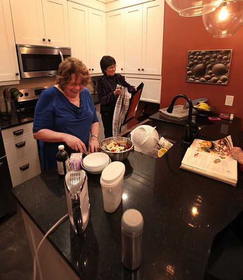 Bev Suek (left) and Nicoline Guerrier are two members of a co-housing collective Women's Housing Initiative Manitoba. Along with two other women, they share a house  and are part of a broader movement of people changing the way we think about co-habitation. They are not just roommates; they are a community. December 7, 2015 - (Phil Hossack / Winnipeg Free Press)