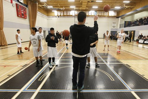 December 7, 2015 - 151207  -  Nathan Marcellin, grade 12 Maples student and basketball player, watches his team play at Maples Collegiate Monday, December 7, 2015. Marcelo, who attended school in Selkirk last year, has been forced to sit out a year under a new policy affecting student athletes who switch schools. John Woods / Winnipeg Free Press