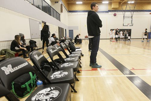 December 7, 2015 - 151207  -  Nathan Marcellin, grade 12 Maples student and basketball player, watches his team play at Maples Collegiate Monday, December 7, 2015. Marcelo, who attended school in Selkirk last year, has been forced to sit out a year under a new policy affecting student athletes who switch schools. John Woods / Winnipeg Free Press