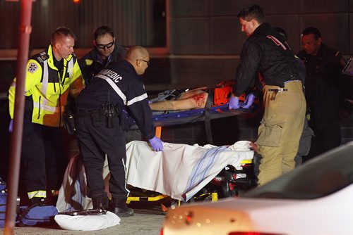 December 7, 2015 - 151207  -  Emergency crews were called to the parking lot at the back of Air Canada building on Carlton for a stabbing victim Monday, December 7, 2015.  John Woods / Winnipeg Free Press