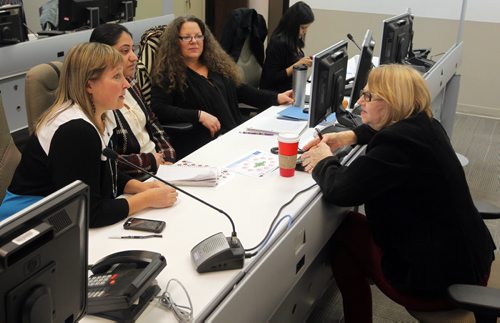 WINNIPEG, MB - Tour of the Syrian refugee command centre at 15th floor, 405 Broadway (Woodsworth Building). Some of people who are meeting in the room chat. No ID available. BORIS MINKEVICH / WINNIPEG FREE PRESS DEC 8, 2015