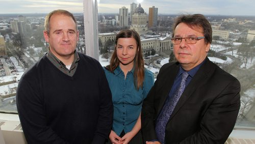 WINNIPEG, MB - Tour of the Syrian refugee command centre at 15th floor, 405 Broadway (Woodsworth Building).  Mike Gagne, Bequie Lake, and Ben Rempel pose for a photo after the news conference. BORIS MINKEVICH / WINNIPEG FREE PRESS DEC 8, 2015