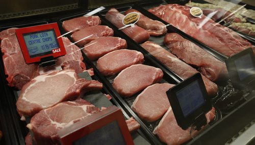Finance. Pork at the meat counter at the Red River Co-op store in the Grant Park Shopping Centre.  For a story on how food prices are expected to rise by another two to four per cent in 2016, with meats, fruits and vegetables once again seeing some of the biggest increases.  Murray McNeill story Wayne Glowacki / Winnipeg Free Press Dec. 9  2015
