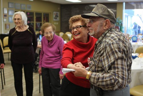 Seniors karaoke and dance.  Bill Call dances with friend - Freda Glow at the Gwen Secter Creative Living Seniors Centre for their annual Christmas and Hanukkah celebration Wednesday afternoon.    If needed names of others in pic -  Executive Director of centre, Marilyn Regiec (his right, grey), Elaine Stein (his left) and Dorothy Bergman (far left in pic, wt blue scarf).  Standup photo  Dec 09, 2015 Ruth Bonneville / Winnipeg Free Press