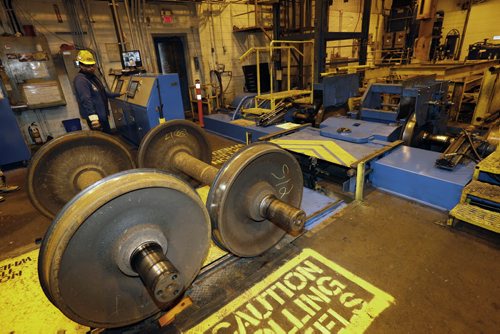 Used train wheels roll up to a machine that de-mounts the wheels in the CNs Transcona Shops. The axles are refurbished and new train wheels are placed on them. The new train wheels are  made at Griffin Wheel Company in Winnipeg  (Griffin Wheel Company in Winnipeg is owned by Amsted Rail).    Martin Cash story Wayne Glowacki / Winnipeg Free Press Dec. 10   2015