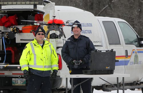Manitoba RCMP has been using drones for the past four years. Sgt Chris McCuen and Cpl. Kenneth Pinsent demonstrates a drone flight at Beaudry Park near Headingley. BORIS MINKEVICH / WINNIPEG FREE PRESS DEC 10, 2015
