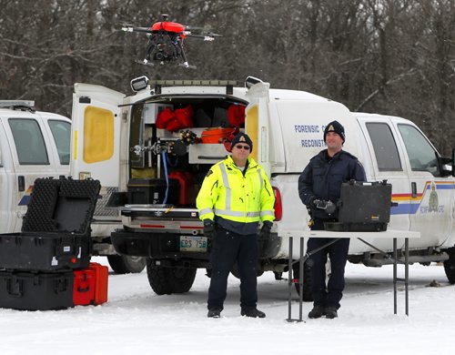 Manitoba RCMP has been using drones for the past four years. Sgt Chris McCuen and Cpl. Kenneth Pinsent demonstrates a drone flight at Beaudry Park near Headingley. BORIS MINKEVICH / WINNIPEG FREE PRESS DEC 10, 2015