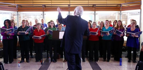 The Electric Chords choir sings at 360 Portage as part of the Miracle on Mountain initiative in Winnipeg on Friday, Dec. 11, 2015.  (Mikaela MacKenzie/Winnipeg Free Press)