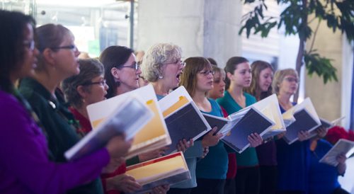 The Electric Chords choir sings at 360 Portage as part of the Miracle on Mountain initiative in Winnipeg on Friday, Dec. 11, 2015.  (Mikaela MacKenzie/Winnipeg Free Press)