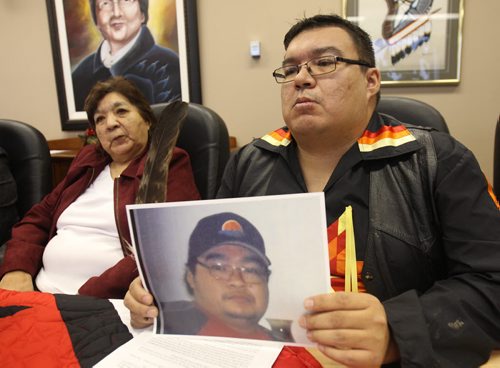 Kelvin McKay, right, and his mother Violet at news conference hold picture of their late brother /son Tyson McKay who died of a heart attack June 25, 2015- The Cross Lake Band calling for a inquiry into poor health services on their band  See StoryDec 11, 2015   (JOE BRYKSA / WINNIPEG FREE PRESS)