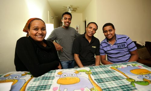 Family portrait of Genet Eshete, Kidus Urga, 17, Yacob Urga, and Yosef Urga, 12, all refugees from Ethiopia, Friday, December 11, 2015. For carol sanders story (TREVOR HAGAN/WINNIPEG FREE PRESS)