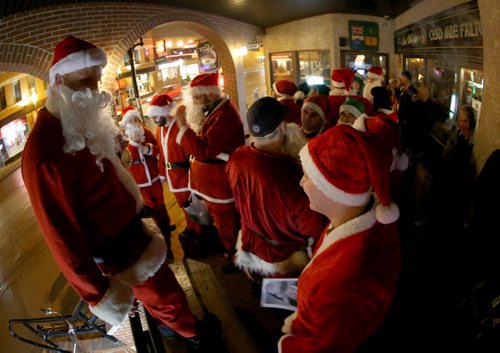 At The Toad in Osborne Village, participants in SantaCon, a charity pub crawl with proceeds going to the Christmas Cheer Board, Saturday, December 12, 2015. . (TREVOR HAGAN/WINNIPEG FREE PRESS)