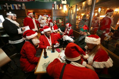 At The Toad in Osborne Village, participants in SantaCon, a charity pub crawl with proceeds going to the Christmas Cheer Board, Saturday, December 12, 2015. . (TREVOR HAGAN/WINNIPEG FREE PRESS)