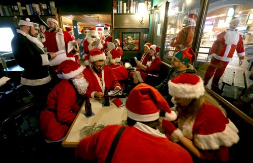 At The Toad in Osborne Village, participants in SantaCon, a charity pub crawl with proceeds going to the Christmas Cheer Board, Saturday, December 12, 2015. . (TREVOR HAGAN/WINNIPEG FREE PRESS)