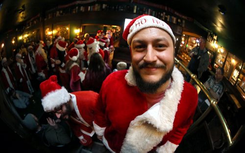 Adam Dudek, organizer, at The Toad in Osborne Village, participants in SantaCon, a charity pub crawl with proceeds going to the Christmas Cheer Board, Saturday, December 12, 2015. . (TREVOR HAGAN/WINNIPEG FREE PRESS)