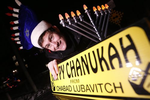 December 13, 2015 - 151213  -  JJ Duchman installs a menorah on his car in preparation for  leading a parade through River Heights and Tuxedo in celebration of the Chanukah season Sunday, December 13, 2015. John Woods / Winnipeg Free Press