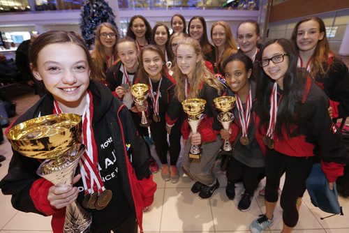 December 13, 2015 - 151213  -  Brynne Abgrall, 12, (L) gold medalist in Modern Solo at the IDO Ballet, Jazz and Modern Championships is photographed with her teammates at Winnipeg airport. Members of Team Canada West dance team arrive at the Winnipeg Airport Sunday, December 13, 2015. Team Canada West which had 17 dancers on it took home four gold medals and one bronze in the 15th World Dance Week in Mikolajki, Poland. Competitors compete for individual and team titles in ballet, jazz and modern dance. John Woods / Winnipeg Free Press