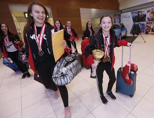 December 13, 2015 - 151213  -  Members of Team Canada West dance team arrive at the Winnipeg Airport Sunday, December 13, 2015. Team Canada West which had 17 dancers on it took home four gold medals and one bronze in the 15th World Dance Week in Mikolajki, Poland. Competitors compete for individual and team titles in ballet, jazz and modern dance. John Woods / Winnipeg Free Press
