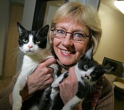 BORIS MINKEVICH / WINNIPEG FREE PRESS  080128 Winnipeg Humane Society's Exec. Dir. Vicki Burns poses with some to-be-adopted pets. She has decided to retire next month.