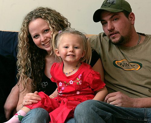 BORIS MINKEVICH / WINNIPEG FREE PRESS  080128 Kerri and Wes Olfert with their daughter Katelynn, who was all banged up in a MVC, pose for a photo at Katelynn's Uncle's place.