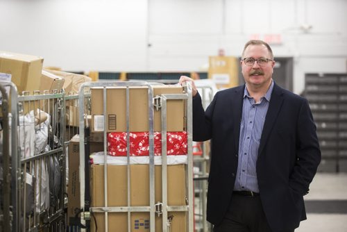 Canada Post spokesperson Eugene Knapik on the busiest day of the year at a sorting facility in Winnipeg on Monday, Dec. 14, 2015.  (Mikaela MacKenzie/Winnipeg Free Press)