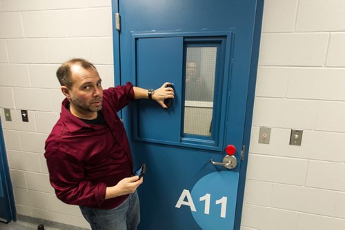 A tour of the new Winnipeg Police Service Headquarters at 245 Smith Street. An interview room with a sliding metal cover for the window. 151214 - Monday, December 14, 2015 -  MIKE DEAL / WINNIPEG FREE PRESS