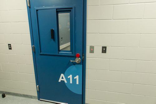 A tour of the new Winnipeg Police Service Headquarters at 245 Smith Street. An interview room with a sliding metal cover for the window. 151214 - Monday, December 14, 2015 -  MIKE DEAL / WINNIPEG FREE PRESS