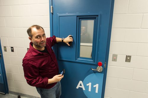 A tour of the new Winnipeg Police Service Headquarters at 245 Smith Street. An interview room with a sliding metal cover for the window. 151214 - Monday, December 14, 2015 -  MIKE DEAL / WINNIPEG FREE PRESS