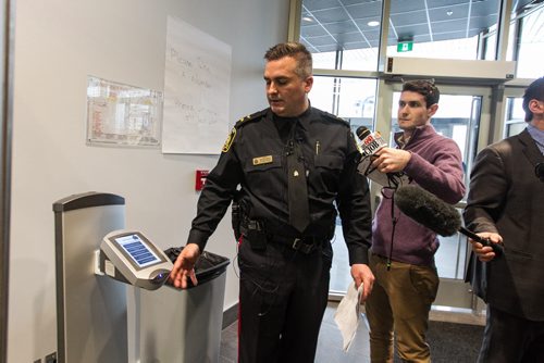 A tour of the new Winnipeg Police Service Headquarters at 245 Smith Street. Public Information Officer Jason Michalyshen explains a new kiosk that will help members of the public make more accurate requests when they come into the HQ. 151214 - Monday, December 14, 2015 -  MIKE DEAL / WINNIPEG FREE PRESS