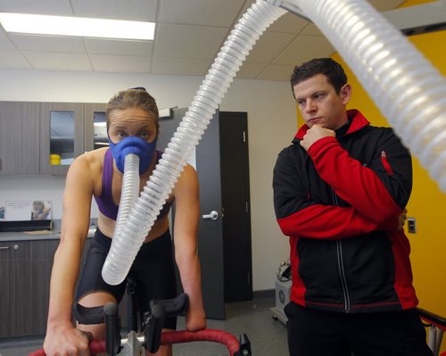 TRAINING BASKET - Right, Daryl Hurrie high-altitude trains athlete Chantal Givens who wants to compete at an Olympic level. Photo taken at Canadian Sports Centre Manitoba at the Frank Kennedy Centre, University of Manitoba. BORIS MINKEVICH / WINNIPEG FREE PRESS DEC 14, 2015