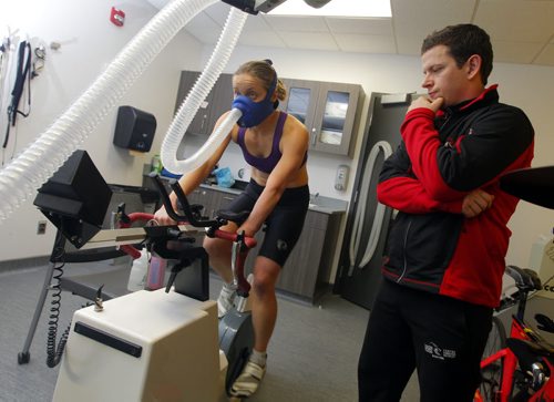 TRAINING BASKET - Right, Daryl Hurrie high-altitude trains athlete Chantal Givens who wants to compete at an Olympic level. Photo taken at Canadian Sports Centre Manitoba at the Frank Kennedy Centre, University of Manitoba. BORIS MINKEVICH / WINNIPEG FREE PRESS DEC 14, 2015