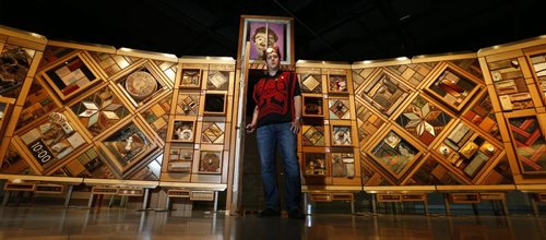 Artist Carey Newman of Vancouver Island with his art installation called The Witness Blanket at the opening Monday in the Canadian Museum For Human Rights.The exhibit was created from hundreds of items reclaimed from residential schools, churches, government buildings, and other structures all across Canada. Intern story Wayne Glowacki / Winnipeg Free Press Dec. 14   2015