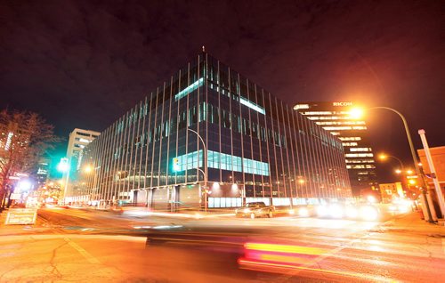 Evening traffic swirls past the new City Poilce HQ building seen from Smith street and St Mary ave. See story. December 14, 2015 - (Phil Hossack / Winnipeg Free Press)