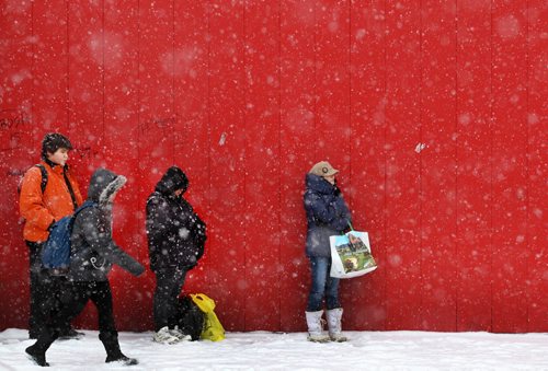 People wait for a bus on Isabel ST in Winnipeg as Wednesdays snow storm sets lowering visibility in the city - Standup PhotoDec 16, 2015   (JOE BRYKSA / WINNIPEG FREE PRESS)