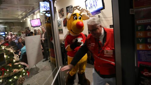 Josh, dressed as Rudy the Operation Red Nose reindeer mascot, and Lawrence Burt from ORN, Saturday, December 12, 2015. . (TREVOR HAGAN/WINNIPEG FREE PRESS)