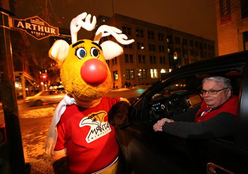 Josh, dressed as Rudy the Operation Red Nose reindeer mascot and Lawrence Burt, from ORN, Saturday, December 12, 2015. . (TREVOR HAGAN/WINNIPEG FREE PRESS)