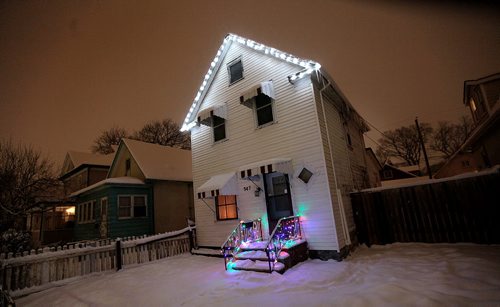 The home of Rodney (76) and Doris Pearson who have lived in house for 45 years. Got notice from city to paint house by this spring or face fine and jail time. A local lighting cpmpany put up a modest display of Christmas lights on the home today. See story. December 16, 2015 - (Phil Hossack / Winnipeg Free Press)