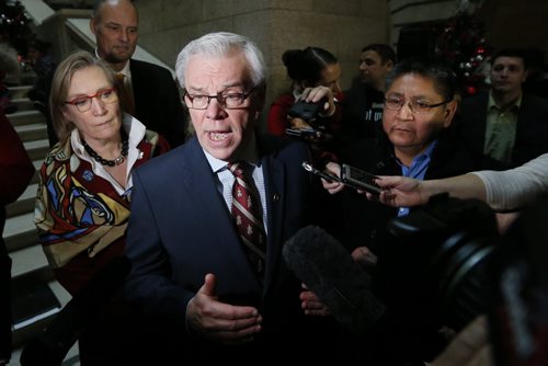 At the Manitoba Legislature in Winnipeg today, Thursday, December 17, 2015 Manitoba Premier Greg Selinger speaks to media as Carolyn Bennett,(L) Minister of Indigenous and Northern Affairs and Chief Erwin Redsky(R), Shoal Lake No.40 First Nation listen in after announcing an intergovernmental partnership that will benefit the First Nation by building a 24 km road from the community to the Trans Canada Highway.   THE CANADIAN PRESS/John Woods