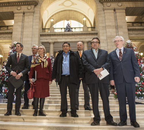 DAVID LIPNOWSKI / WINNIPEG FREE PRESS 151217   (L-R) Mayor Brian Bowman, Member of Parliament for Winnipeg South Centre Jim Carr, Federal Indigenous and Northern Affairs Minister Carolyn Bennett, Chief Erwin Redsky of Shoal Lake 40 First Nation, Drew Caldwell, minister responsible for the City of Winnipeg, MLA Eric Robinson, and Premier Greg Selinger during a joint funding announcement for Freedom Road to Shoal Lake at the Manitoba Legislature Thursday December 17, 2015.