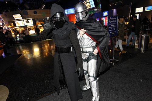 Jonathan Felgueiras (left) as Kylo Ren and Kylie Shuparski (right) as Captain Phasma arrive for the 7pm screening of the new Star Wars film, The Force Awakens at the Polo Park Cineplex Thursday.   151217 December 17, 2015 MIKE DEAL / WINNIPEG FREE PRESS