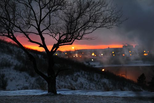 The remains of the sun's red and pink hue adds a splash of colour to the wintery scene at dusk on Garbage Hill Friday afternoon, Standup photo  Dec 18, 2015 Ruth Bonneville / Winnipeg Free Press