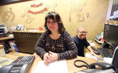Owner Cathy Rickner and her brother Walter Yee deal with advance orders at 4 Seasons Chinese Food at Southdale Centre on Dec. 18, 2015. The Chinese take-out and delivery restaurant has been in operation for almost 30 years and is extremely busy this time of year. Customers usually start placing their orders for Christmas and New Years Eve in August or September. Photo by Jason Halstead/Winnipeg Free Press RE: Dave Sanderson story