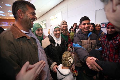 The Daas family from Syria, one of the first families to arrive into Winnipeg, are all smiles as they are greeted by sponsors at the Airport Saturday.  See MA story.  Dec 19, 2015 Ruth Bonneville / Winnipeg Free Press